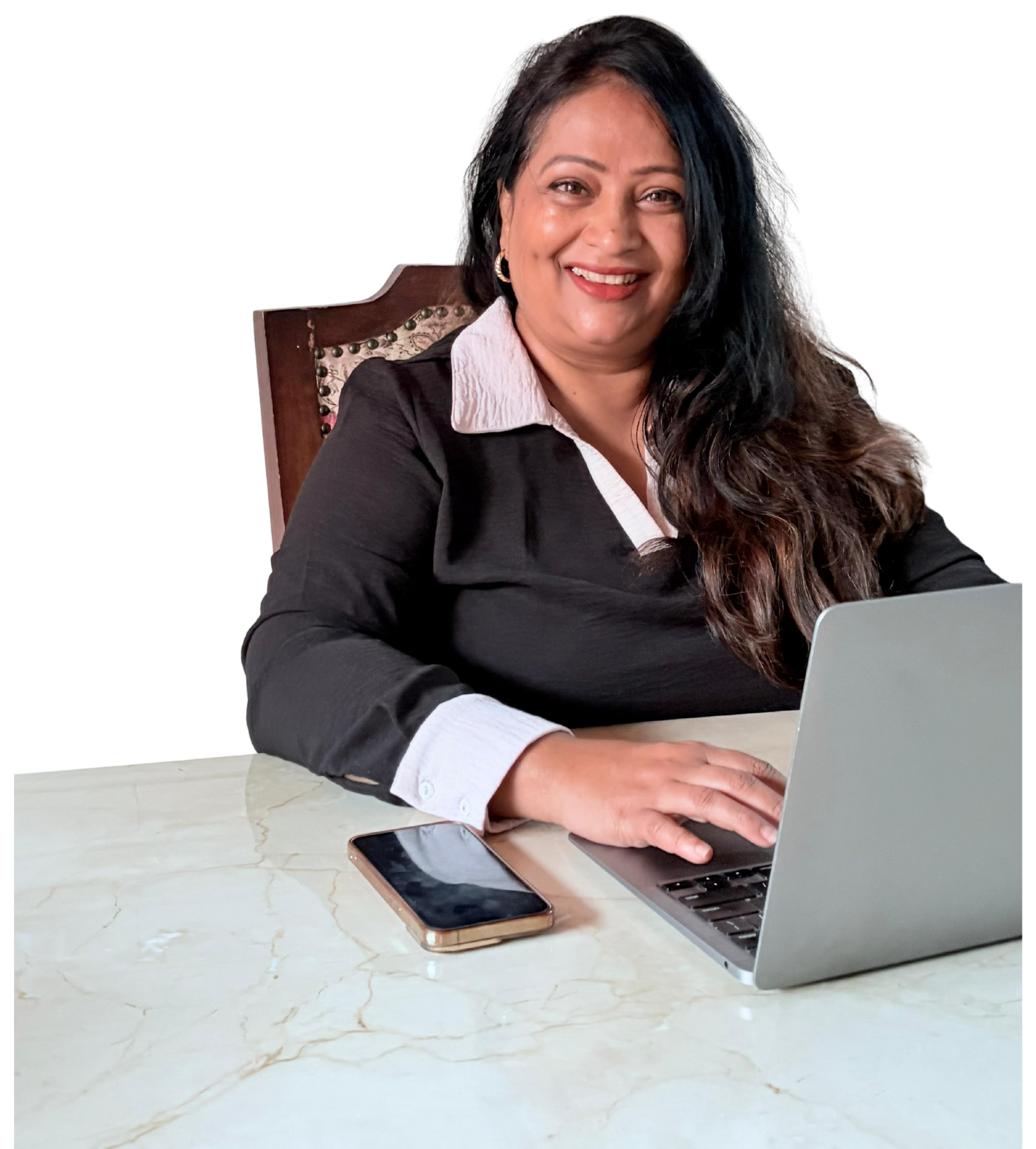 Lakshmi Keerthi, Founder of The Wedding Business School, working at a desk